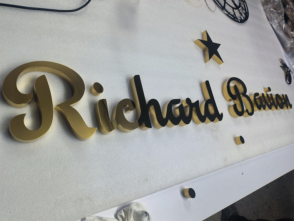 Electroplated mirror-gold letters