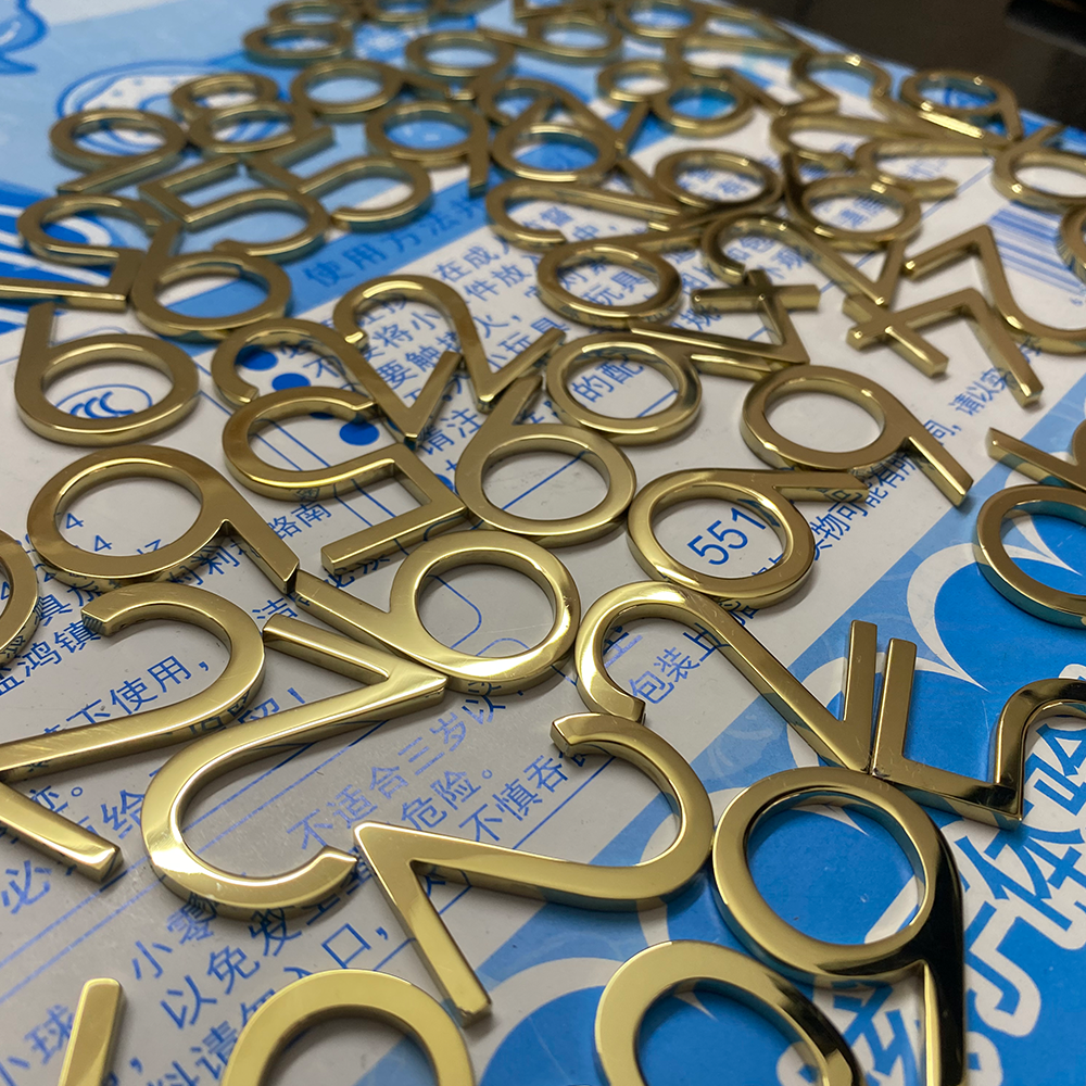 Laser-cut solid gold letters