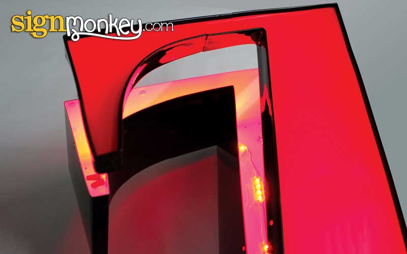 Channel letter acrylic face with perimeter trim cap used to retain the illuminated face