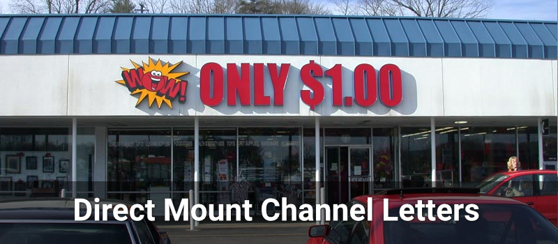 Direct-mount flush channel letters on a white retail façade without a visible raceway